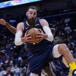 
              New Orleans Pelicans center Jonas Valanciunas pulls down a rebound in the first half of an NBA basketball game against the Sacramento Kings in New Orleans, Wednesday, March 2, 2022. (AP Photo/Gerald Herbert)
            