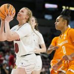
              Louisville's Hailey Van Lith, left, heads to the basket as Tennessee's Brooklynn Miles (0) defends during the first half of a college basketball game in the Sweet 16 round of the NCAA women's tournament Saturday, March 26, 2022, in Wichita, Kan. (AP Photo/Jeff Roberson)
            