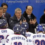 
              FILE - From left to right, South Korea President Moon Jae-in, IOC President Thomas Bach, North Korea's nominal head of state Kim Yong Nam and Kim Yo Jong, sister of North Korean leader Kim Jong Un, greet players after the women's hockey game between Switzerland and the combined Koreas at the Winter Olympics in Gangneung, South Korea, Saturday, Feb. 10, 2018. The International Olympic Committee has always been political, from the sheikhs and royals in its membership to a seat at the United Nations to pushing for peace talks between the Koreas. But Russia’s invasion of Ukraine three weeks ago exposed its irreconcilable claims of “political neutrality.” (AP Photo/Jae C. Hong, File)
            