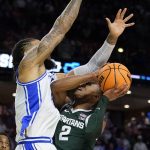 
              Duke forward Theo John blocks Michigan State guard Tyson Walker during the second half of a college basketball game in the second round of the NCAA tournament on Sunday, March 20, 2022, in Greenville, S.C. (AP Photo/Chris Carlson)
            