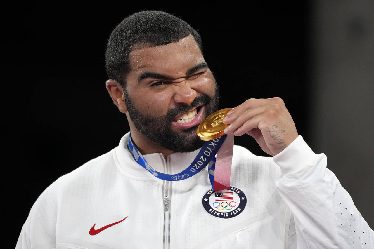 FILE - In this Aug. 6, 2021, file photo, United State's Gable Dan Steveson poses with his gold meda...