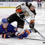 
              New York Islanders center Brock Nelson (29) looks to control the puck under Anaheim Ducks left wing Sonny Milano in the second period of an NHL hockey game Sunday, March 13, 2022, in Elmont, N.Y. (AP Photo/Adam Hunger)
            