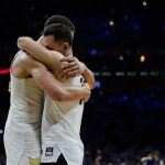 
              Purdue's Mason Gillis, left, and Jared Wulbrun embrace after Purdue lost a college basketball game against Saint Peter's in the Sweet 16 round of the NCAA tournament, Friday, March 25, 2022, in Philadelphia. (AP Photo/Matt Rourke)
            