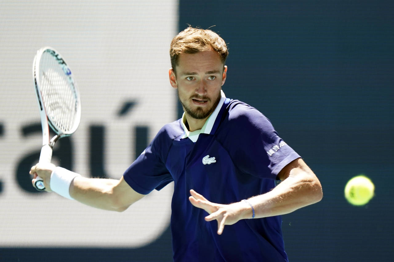 Daniil Medvedev, of Russia ,returns a shot from Andy Murray, of Britain, during the Miami Open tenn...