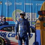 
              Kyle Larson stands under the podium after winning the NASCAR Cup Series auto race at Auto Club Speedway Sunday, Feb. 27, 2022, in Fontana, Calif. (AP Photo/Marcio Jose Sanchez)
            