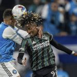 
              Charlotte FC defender Jaylin Lindsey, left, and LA Galaxy forward Kevin Cabral (9) jump for a head ball during the first half of an MLS soccer match in Charlotte, N.C., Saturday, March 5, 2022. (AP Photo/Jacob Kupferman)
            
