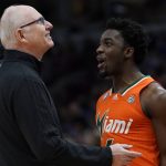 
              Miami head coach Jim Larranaga talks to Bensley Joseph during the second half of a college basketball game in the Elite 8 round of the NCAA tournament Sunday, March 27, 2022, in Chicago. (AP Photo/Charles Rex Arbogast)
            