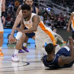 
              Tennessee guard Victor Bailey Jr. (12) loses the ball as he collides with Longwood guard DeShaun Wade, right, during the second half of a college basketball game in the first round of the NCAA tournament in Indianapolis, Thursday, March 17, 2022. (AP Photo/Michael Conroy)
            
