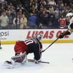 
              Boston Bruins' David Pastrnak, right, scores against Columbus Blue Jackets' Elvis Merzlikins during the shootout of an NHL hockey game Saturday, March 5, 2022, in Columbus, Ohio. (AP Photo/Jay LaPrete)
            