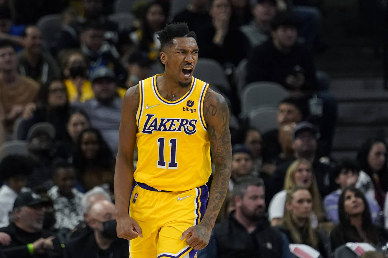 Los Angeles Lakers guard Malik Monk (11) reacts after scoring against the San Antonio Spurs during ...
