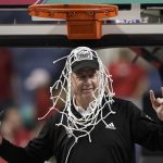 
              North Carolina State head coach Wes Moore celebrates after cutting the net following an NCAA college basketball championship game against Miami at the Atlantic Coast Conference women's tournament in Greensboro, N.C., Sunday, March 6, 2022. (AP Photo/Gerry Broome)
            