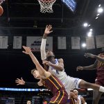 
              Drake's ShanQuan Hemphill, center, loses control of the ball as Loyola of Chicago's Braden Norris, left, and Aher Uguak (30) defend during the second half of an NCAA college basketball game in the championship of the Missouri Valley Conference tournament Sunday, March 6, 2022, in St. Louis. (AP Photo/Jeff Roberson)
            
