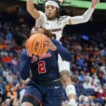 
              South Carolina's Destanni Henderson, top, defends against Mississippi's Mimi Reid (2) in the first half of an NCAA college basketball semifinal round game at the women's Southeastern Conference tournament Saturday, March 5, 2022, in Nashville, Tenn. (AP Photo/Mark Humphrey)
            