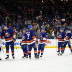 
              New York Islanders goaltender Semyon Varlamov (40) celebrates with teammates after an NHL hockey game against the Columbus Blue Jackets on Thursday, March 31, 2022, in Elmont, N.Y. The Islanders won 5-2. (AP Photo/Frank Franklin II)
            