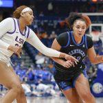
              LSU's Hannah Gusters, left, defends against Kentucky's Treasure Hunt (12) in the first half of an NCAA college basketball game at the women's Southeastern Conference tournament Friday, March 4, 2022, in Nashville, Tenn. (AP Photo/Mark Humphrey)
            