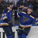 
              St. Louis Blues' Alexei Toropchenko, right, is congratulated by Niko Mikkola (77) after scoring during the second period of an NHL hockey game against the Philadelphia Flyers Thursday, March 24, 2022, in St. Louis. (AP Photo/Jeff Roberson)
            