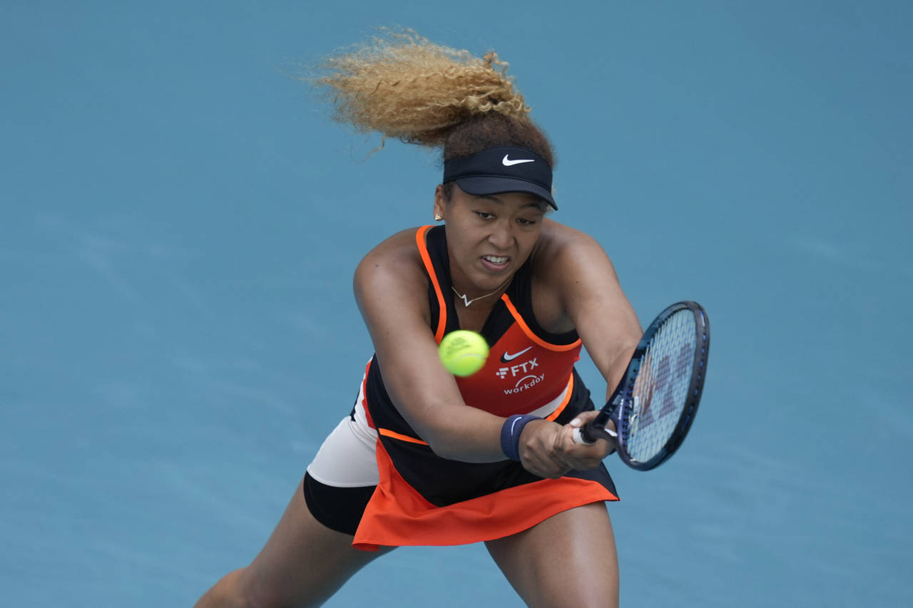 Naomi Osaka of Japan lunges for a ball in her second round women's match against Angelique Kerber o...