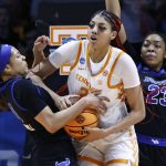 
              Tennessee center Tamari Key (20) battles for the ball with Buffalo guard Summer Hemphill (0) during the second half of a college basketball game in the first round of the NCAA Tournament, Saturday, March 19, 2022, in Knoxville, Tenn. (AP Photo/Wade Payne)
            