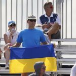 
              A fan displays a Ukrainian flag as he watches a match between Elina Svitolina, of Ukraine, and Heather Watson, of Britain, at the Miami Open tennis tournament, Thursday, March 24, 2022, in Miami Gardens, Fla. (AP Photo/Wilfredo Lee)
            