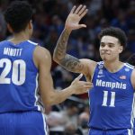 
              Memphis guard Lester Quinones (11) greets forward Josh Minott (20) after a shot during the first half of a second-round NCAA college basketball tournament game against Gonzaga, Saturday, March 19, 2022, in Portland, Ore. (AP Photo/Craig Mitchelldyer)
            