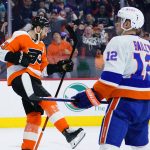 
              Philadelphia Flyers' Kevin Hayes, left, celebrates past New York Islanders' Josh Bailey after scoring a goal during the second period of an NHL hockey game, Sunday, March 20, 2022, in Philadelphia. (AP Photo/Matt Slocum)
            
