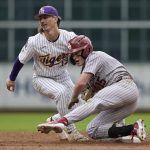 
              Oklahoma's Jackson Nicklaus (15) is tagged out at second by LSU's Jordan Thompson (13) while trying to stretch a single into a double during an NCAA college baseball game at Minute Maid Park, home of the Houston Astros, Friday, March 4, 2022, in Houston. College baseball might turn out to be an attractive alternative for baseball fans if the Major League Baseball lockout extends deep into the spring. (AP Photo/David J. Phillip)
            