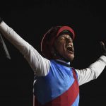 
              Country Grammer's jockey Frankie Dettori reacts after winning Group 1 Dubai World Cup over 2000m (10 furlongs) at Meydan Racecourse in Dubai, United Arab Emirates, Saturday, March 26, 2022. (AP Photo/Martin Dokoupil)
            