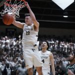 
              Bryant guard Peter Kiss (32) slams a dunk during the first half of the Northeast Conference men's NCAA college basketball championship game against Wagner, Tuesday, March 8, 2022, in Smithfield, R.I. (AP Photo/Charles Krupa)
            