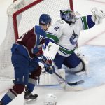 
              Vancouver Canucks goaltender Jaroslav Halak, right, makes a glove save as Colorado Avalanche right wing Valeri Nichushkin watches during the first period of an NHL hockey game Wednesday, March 23, 2022, in Denver. (AP Photo/David Zalubowski)
            