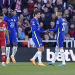 
              Chelsea's Hakim Ziyech, right, celebrates after scoring his side's 2nd goalduring the English FA Cup quarter final soccer match between Middlesbrough and Chelsea at the Riverside Stadium, in Middlesbrough, England, Saturday March 19, 2022. (AP Photo/Jon Super)
            