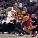 
              Cleveland Cavaliers' Isaac Okoro (35) drives against Chicago Bulls' DeMar DeRozan (11) during the first half of an NBA basketball game Saturday, March 26, 2022, in Cleveland. (AP Photo/Ron Schwane)
            
