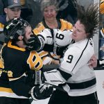 
              Los Angeles Kings center Adrian Kempe (9) fights with Boston Bruins defenseman Derek Forbort, left, during the third period of an NHL hockey game, Monday, March 7, 2022, in Boston. (AP Photo/Charles Krupa)
            