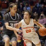 
              Princeton guard Kaitlyn Chen (20) drives past Columbia guard Abbey Hsu (35) during the first half of an NCAA Ivy League women's college basketball championship game, Saturday, March 12, 2022, in Cambridge, Mass. (AP Photo/Mary Schwalm)
            