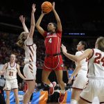 
              Georgia guard Mikayla Coombs (4) shoots over Iowa State guard Emily Ryan, left, during the first half of a second-round game in the NCAA women's college basketball tournament, Sunday, March 20, 2022, in Ames, Iowa. (AP Photo/Charlie Neibergall)
            