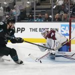 
              Colorado Avalanche goaltender Pavel Francouz, right, defends against a shot by San Jose Sharks center Logan Couture during the first period of an NHL hockey game in San Jose, Calif., Friday, March 18, 2022. (AP Photo/Jeff Chiu)
            