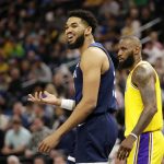 
              Minnesota Timberwolves center Karl-Anthony Towns argues after being called for charging as Los Angeles Lakers forward LeBron James, right, defended during the first half of an NBA basketball game Wednesday, March 16, 2022, in Minneapolis. (AP Photo/Andy Clayton-King)
            