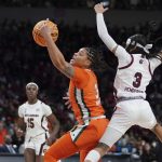 
              Miami forward Destiny Harden (3) catches a pass against South Carolina guard Destanni Henderson (3) during the first half of a second-round game in the NCAA college basketball tournament, Sunday, March 20, 2022 in Columbia, S.C. (AP Photo/Sean Rayford)
            
