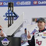 
              William Byron (24) poses with the trophy after winning a NASCAR Cup Series auto race at Atlanta Motor Speedway in Hampton, Ga., Sunday, March 20, 2022. (AP Photo/John Bazemore)
            
