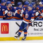 
              New York Islanders right wing Oliver Wahlstrom (26) celebrates after scoring on Detroit Red Wings goaltender Thomas Greiss during the first period of an NHL hockey game Thursday, March 24, 2022, in Elmont, N.Y. (AP Photo/John Minchillo)
            