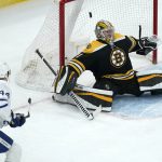 
              Boston Bruins goaltender Jeremy Swayman (1) drops back towards the net on a goal by Toronto Maple Leafs defenseman Morgan Rielly (44) during the first period of an NHL hockey game, Tuesday, March 29, 2022, in Boston. (AP Photo/Charles Krupa)
            