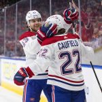 
              Montreal Canadiens' Kale Clague (43) and Cole Caufield (22) celebrate a goal against the Edmonton Oilers during first-period NHL hockey game action in Edmonton, Alberta, Saturday, March 5, 2022. (Jason Franson/The Canadian Press via AP)
            
