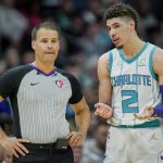 
              Charlotte Hornets guard LaMelo Ball (2) discusses a call with referee Mark Lindsay, left, during the first half of an NBA basketball game against the Denver Nuggets, Monday, March 28, 2022, in Charlotte, N.C. (AP Photo/Rusty Jones)
            