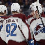 
              Colorado Avalanche defenseman Cale Makar (8) celebrates with teammates left wing Gabriel Landeskog (92) and center Nathan MacKinnon (29) after his goal against the New York Islanders in the first period of an NHL hockey game on Monday, March 7, 2022, in Elmont, N.Y. (AP Photo/Jim McIsaac)
            