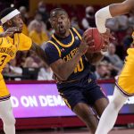
              California guard Makale Foreman (10) drives as Arizona State guard Marreon Jackson (3) defends during the first half of an NCAA college basketball game, Thursday, March 3, 2022, in Tempe, Ariz. (AP Photo/Matt York)
            