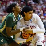 
              Indiana forward Kiandra Browne (23) gets tied up by Charlotte forward KeKe McKinney (40) in the first half of a college basketball game in the first round of the NCAA tournament in Bloomington, Ind., Saturday, March 19, 2022. (AP Photo/Michael Conroy)
            