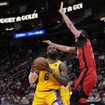 
              Los Angeles Lakers' LeBron James (6) goes up for a shot as Houston Rockets' Garrison Mathews defends during the first half of an NBA basketball game Wednesday, March 9, 2022, in Houston. (AP Photo/David J. Phillip)
            