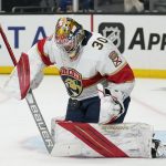 
              Florida Panthers goaltender Spencer Knight (30) stops a shot during the second period of an NHL hockey game against the Los Angeles Kings Sunday, March 13, 2022, in Los Angeles. (AP Photo/Ashley Landis)
            