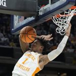 
              Tennessee's Kennedy Chandler dunks during the first half of a college basketball game against Michigan in the second round of the NCAA tournament, Saturday, March 19, 2022, in Indianapolis. (AP Photo/Darron Cummings)
            