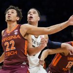 
              Virginia Tech's Keve Aluma (22) and Notre Dame's Paul Atkinson Jr., center, box out for a rebound off a free throw in the second half of an NCAA college basketball game during quarterfinals of the Atlantic Coast Conference men's tournament, Thursday, March 10, 2022, in New York. (AP Photo/John Minchillo)
            