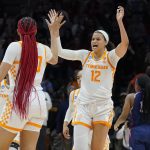 
              Tennessee's Rae Burrell (12) celebrates with Tamari Key (20) after Tennessee beat Belmont 70-67 in a women's college basketball game in the second round of the NCAA tournament Monday, March 21, 2022, in Knoxville, Tenn. (AP Photo/Mark Humphrey)
            